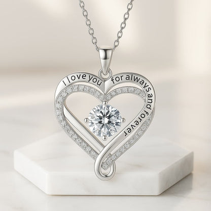 The Eternal Heart silver necklace close-up, engraved 'I love you for always and forever' with a sparkling centre stone