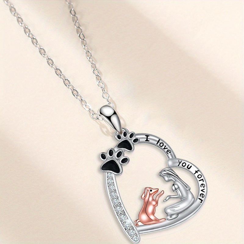 Side view of The Dog Mom Heart necklace with paw prints and dog charm