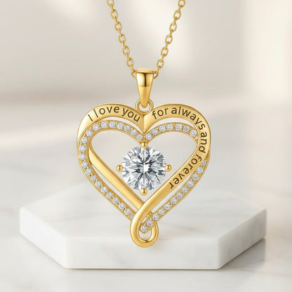 The Eternal Heart gold necklace close-up, engraved 'I love you for always and forever' with a sparkling centre stone