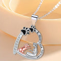 The Dog Mom Heart silver necklace with girl-and-dog charm, paw prints and 'I love you forever' engraving