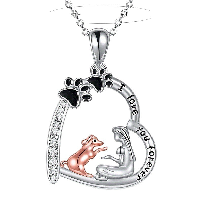 The Dog Mom Heart pendant with girl and dog inside an engraved heart