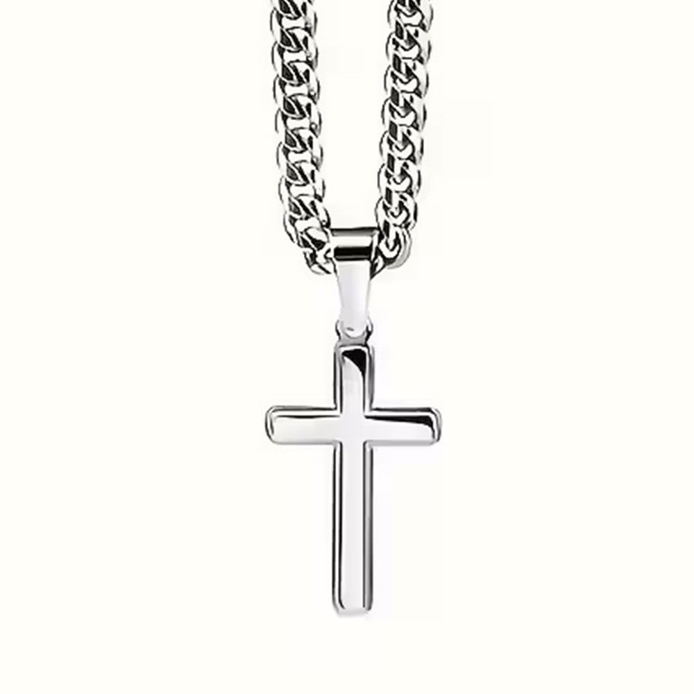 Mirror-polished silver cross pendant on a Cuban link chain