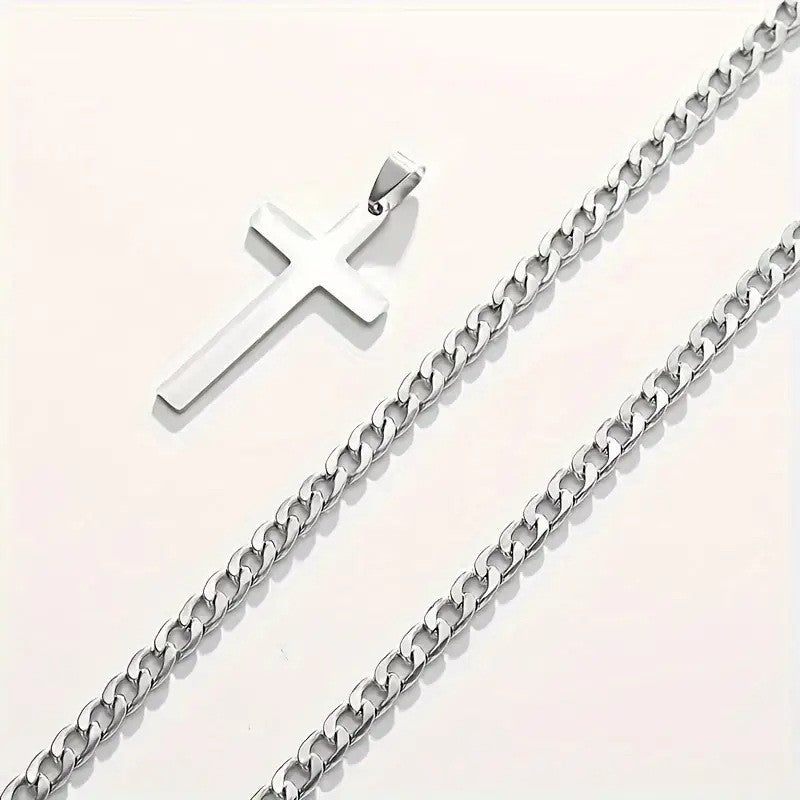 Close-up of the silver Cuban link chain and cross pendant