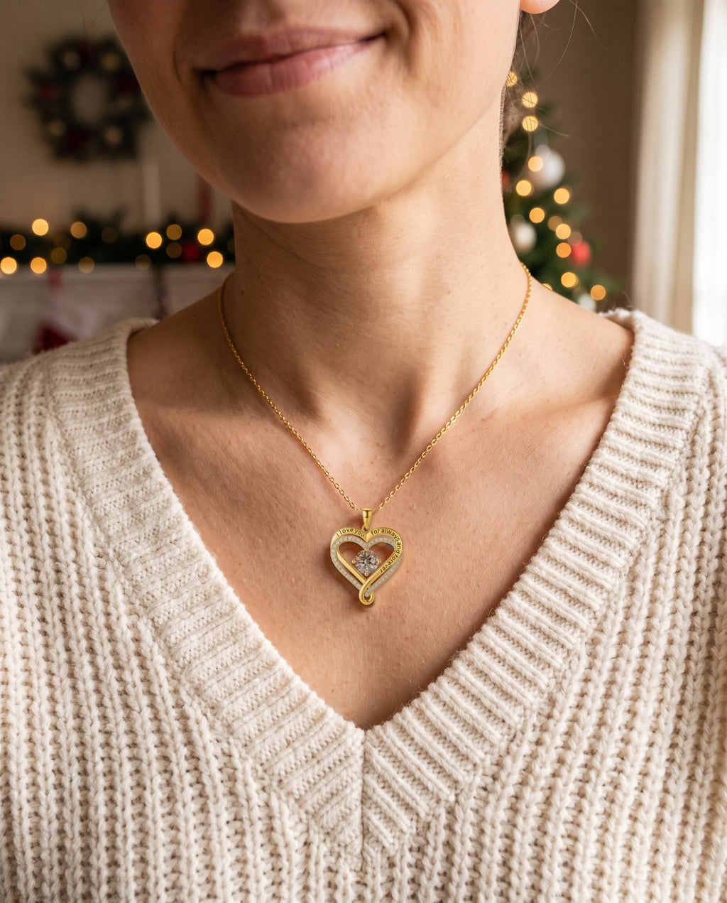 Woman wearing The Eternal Heart gold necklace engraved 'I love you for always and forever', a Christmas gift for wife